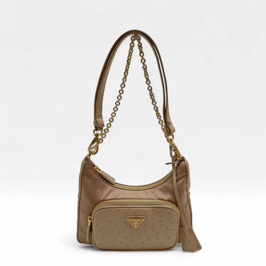 https://cdn.shopify.com/s/files/1/0564/9376/8855/files/Prada_Handtasche_Re-Nylon_Strauss_beige_handbag5043.webp?v=1761264119