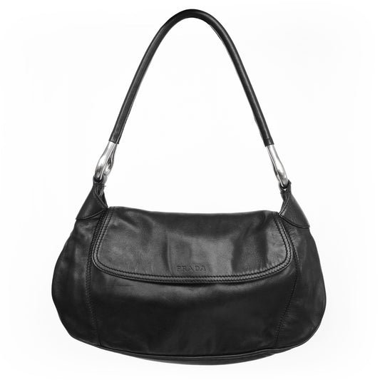 Prada SS 2003 shoulder bag in black Nappa leather with metal hoop strap details. Available at Artefact Archive.
