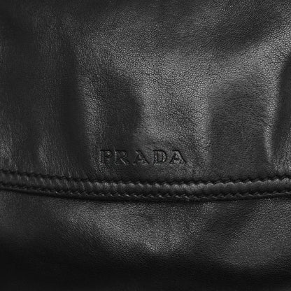 Prada SS 2003 shoulder bag in black Nappa leather with metal hoop strap details. Available at Artefact Archive.