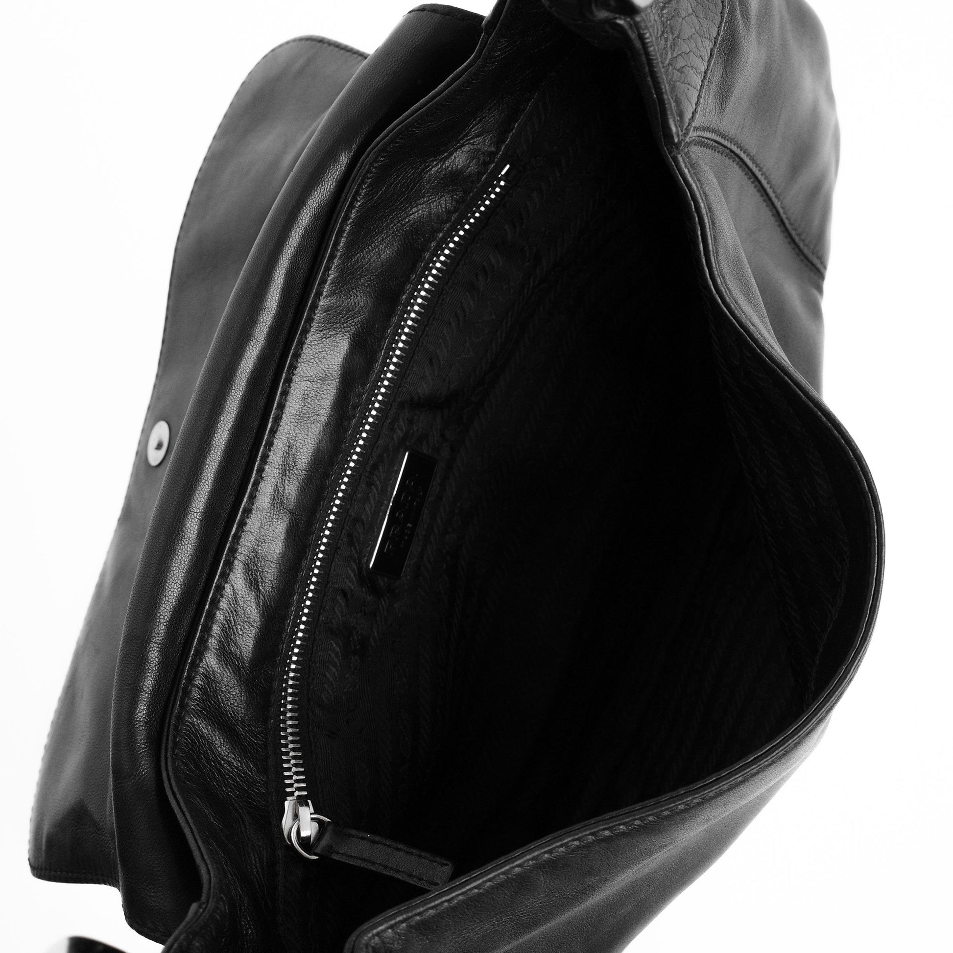 Prada SS 2003 shoulder bag in black Nappa leather with metal hoop strap details. Available at Artefact Archive.