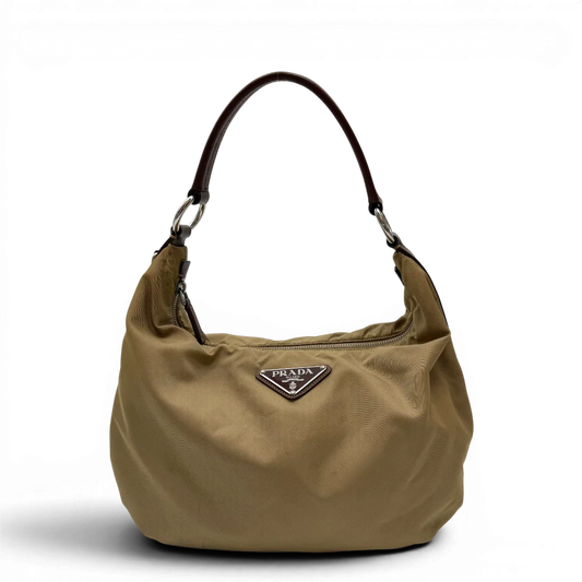 https://cdn.shopify.com/s/files/1/0564/9376/8855/files/Prada_Schultertasche_Hobo_Croissant_aus_Nylon_beige_vintage7733.webp?v=1780487479