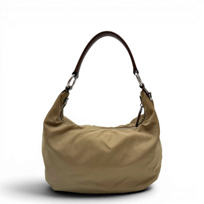 https://cdn.shopify.com/s/files/1/0564/9376/8855/files/Prada_Schultertasche_Hobo_Croissant_aus_Nylon_beige_vintage7734.webp?v=1780487479