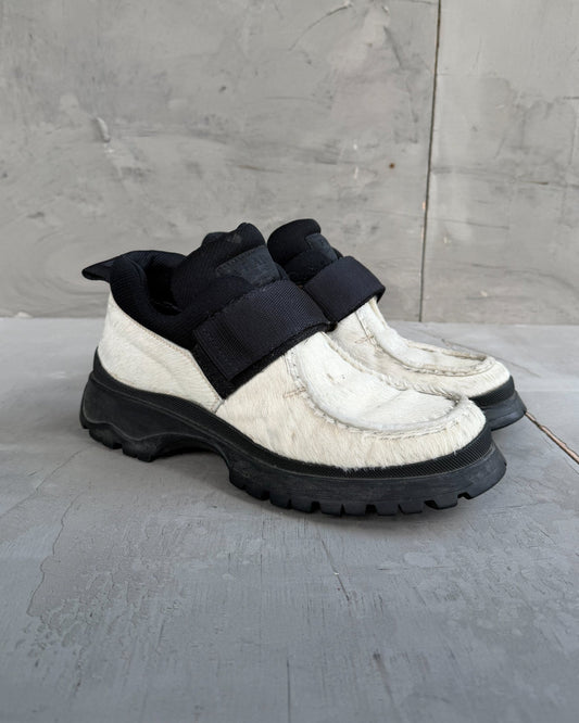 Prada FW99 Fur Vibram Heel Derbys – EU 38-on a concrete background