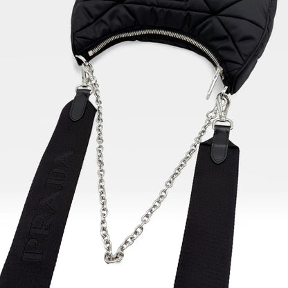 https://cdn.shopify.com/s/files/1/0564/9376/8855/files/Prada_Umhangetasche_Tessuto_Stepp_aus_Nylon_schwarz_vintage_crossbody_5818.webp?v=1765452267