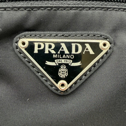 https://cdn.shopify.com/s/files/1/0564/9376/8855/files/Prada_Umhangetasche_basic_small_aus_Nylon_schwarz_vintage8294.webp?v=1781084674