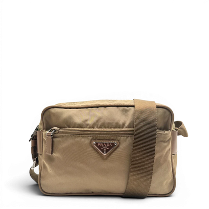 https://cdn.shopify.com/s/files/1/0564/9376/8855/files/Prada_Umhangetasche_rechteckig_small_aus_Nylon_hellbraun_1.webp?v=1782311805