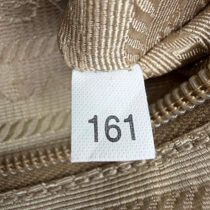 https://cdn.shopify.com/s/files/1/0564/9376/8855/files/Prada_Umhangetasche_rechteckig_small_aus_Nylon_hellbraun_16.webp?v=1782311805
