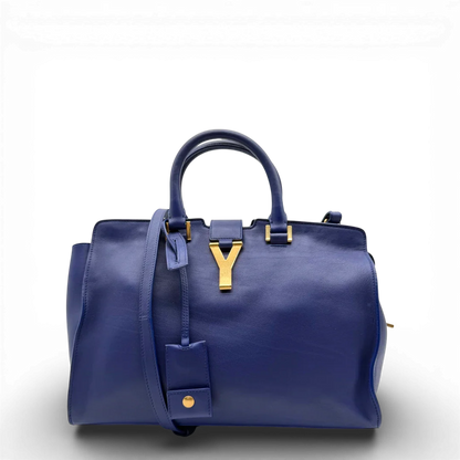 https://cdn.shopify.com/s/files/1/0564/9376/8855/files/Saint_Laurent_Handtasche_Cabbas_mit_Umhangegurt_aus_Leder_blau_vintage2601.webp?v=1773312218