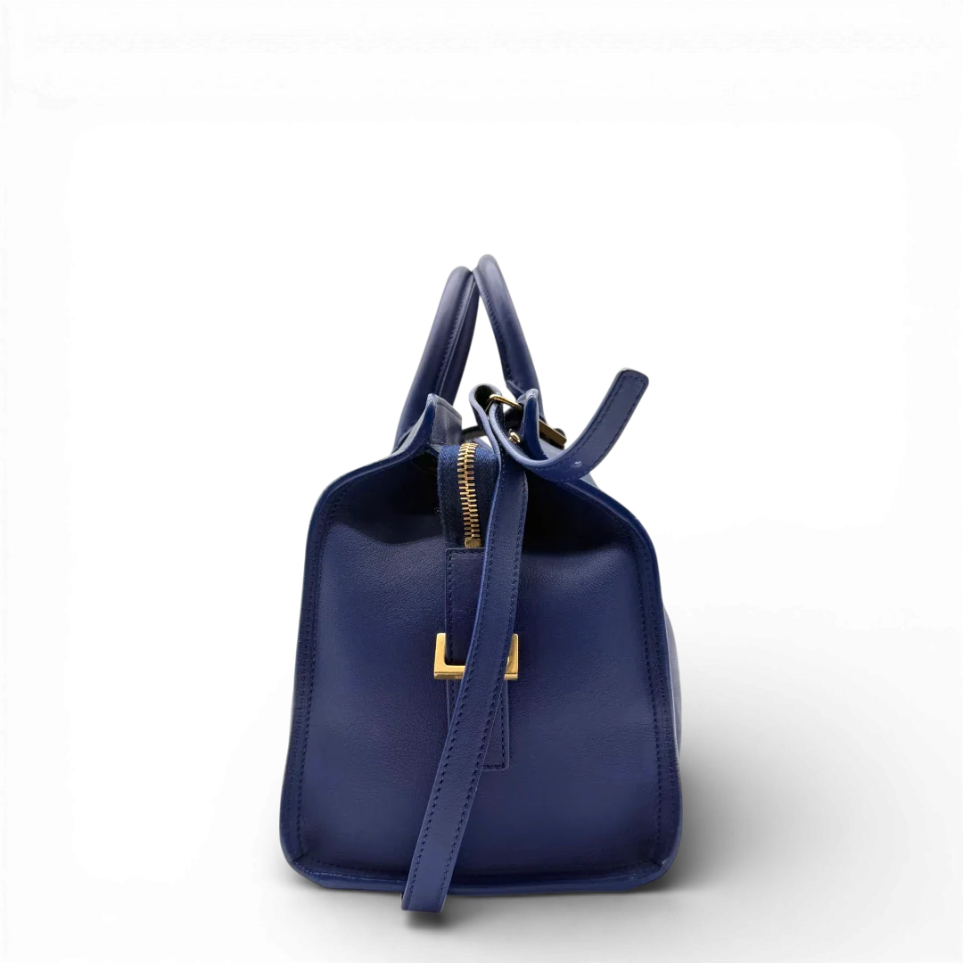 https://cdn.shopify.com/s/files/1/0564/9376/8855/files/Saint_Laurent_Handtasche_Cabbas_mit_Umhangegurt_aus_Leder_blau_vintage2604.webp?v=1773312218