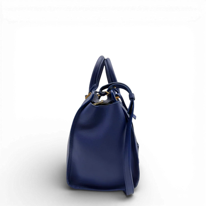 https://cdn.shopify.com/s/files/1/0564/9376/8855/files/Saint_Laurent_Handtasche_Cabbas_mit_Umhangegurt_aus_Leder_blau_vintage2605.webp?v=1773312218