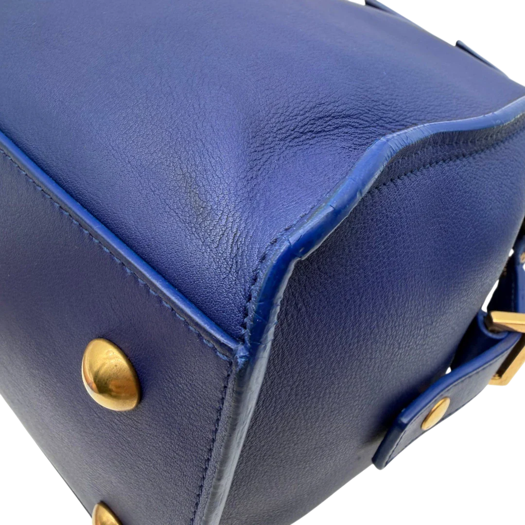 https://cdn.shopify.com/s/files/1/0564/9376/8855/files/Saint_Laurent_Handtasche_Cabbas_mit_Umhangegurt_aus_Leder_blau_vintage2607.webp?v=1773312218