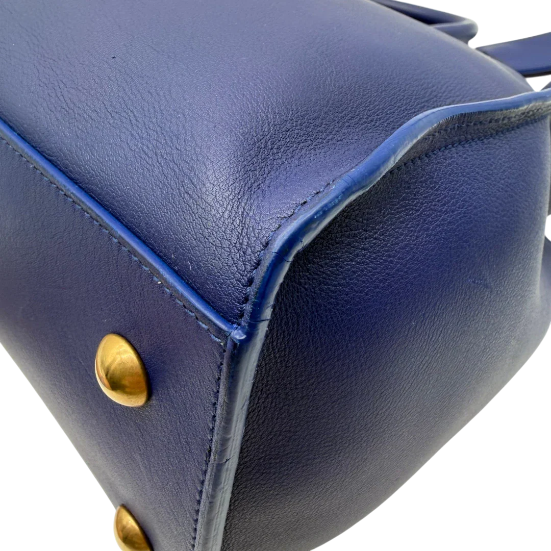 https://cdn.shopify.com/s/files/1/0564/9376/8855/files/Saint_Laurent_Handtasche_Cabbas_mit_Umhangegurt_aus_Leder_blau_vintage2609.webp?v=1773312218