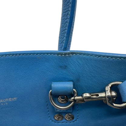 https://cdn.shopify.com/s/files/1/0564/9376/8855/files/Saint_Laurent_Handtasche_Sac_de_Jour_Nano_Leder_hellblau_vintage0137.webp?v=1775655025