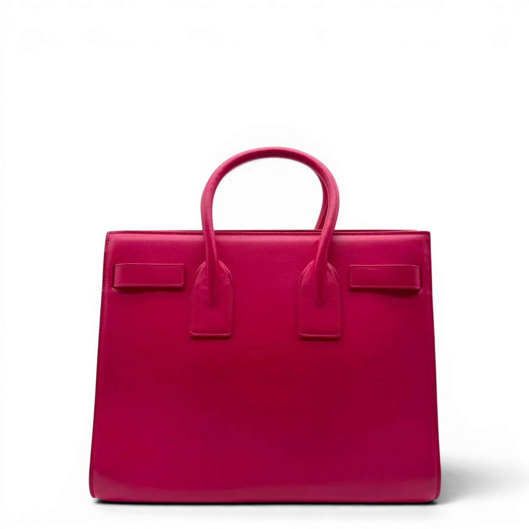 https://cdn.shopify.com/s/files/1/0564/9376/8855/files/Saint_Laurent_Handtasche_Sac_de_Jour_medium_aus_Leder_pink_vintage_YSL7098.webp?v=1779895629