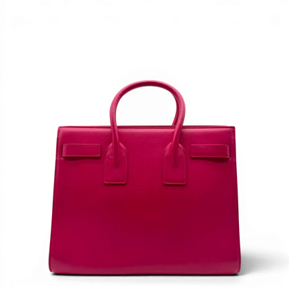 https://cdn.shopify.com/s/files/1/0564/9376/8855/files/Saint_Laurent_Handtasche_Sac_de_Jour_medium_aus_Leder_pink_vintage_YSL7098.webp?v=1779895629
