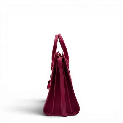 https://cdn.shopify.com/s/files/1/0564/9376/8855/files/Saint_Laurent_Handtasche_Sac_de_Jour_medium_aus_Leder_pink_vintage_YSL7102.webp?v=1779895629