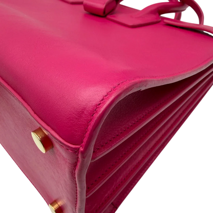 https://cdn.shopify.com/s/files/1/0564/9376/8855/files/Saint_Laurent_Handtasche_Sac_de_Jour_medium_aus_Leder_pink_vintage_YSL7105.webp?v=1779895630