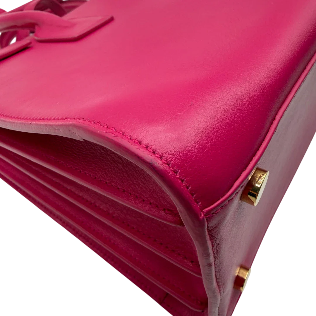 https://cdn.shopify.com/s/files/1/0564/9376/8855/files/Saint_Laurent_Handtasche_Sac_de_Jour_medium_aus_Leder_pink_vintage_YSL7107.webp?v=1779895630