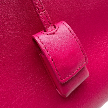 https://cdn.shopify.com/s/files/1/0564/9376/8855/files/Saint_Laurent_Handtasche_Sac_de_Jour_medium_aus_Leder_pink_vintage_YSL7109.webp?v=1779895630
