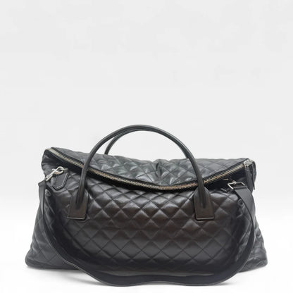 https://cdn.shopify.com/s/files/1/0564/9376/8855/files/Saint_Laurent_Reisetasche_ES_Giant_Quilted_aus_Leder_schwarz0900.webp?v=1761266314