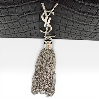 https://cdn.shopify.com/s/files/1/0564/9376/8855/files/Saint_Laurent_Umhaengetasche_Kate_Tassel_Small_Croco_schwarz_vintage_8955.webp?v=1769160154