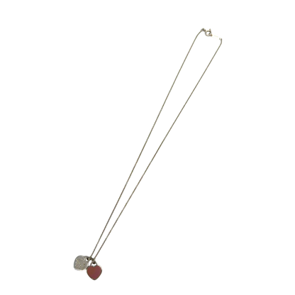 https://cdn.shopify.com/s/files/1/0564/9376/8855/files/Tiffany___Co._Halskette_Zwillingsherzen_rosa_aus_925_Silber_vintage7774.webp?v=1779406370