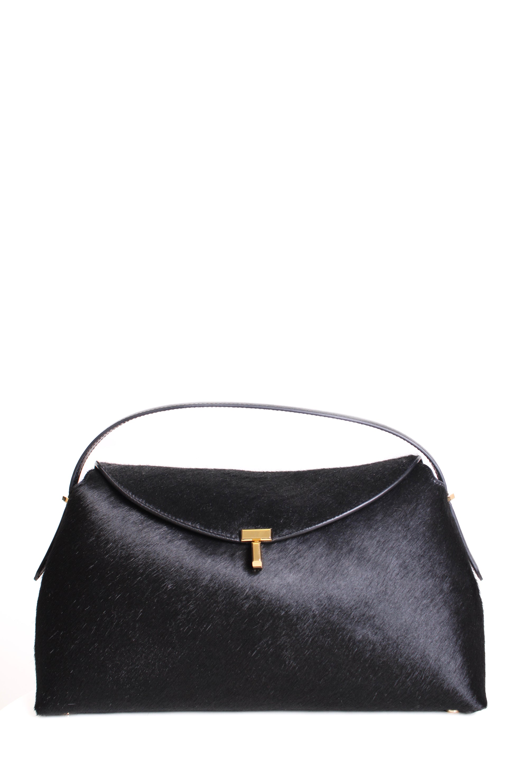 https://cdn.shopify.com/s/files/1/0770/3278/4192/files/Toteme_T_Lock_Pony_Hair_Bag_Black.jpg?v=1766441030