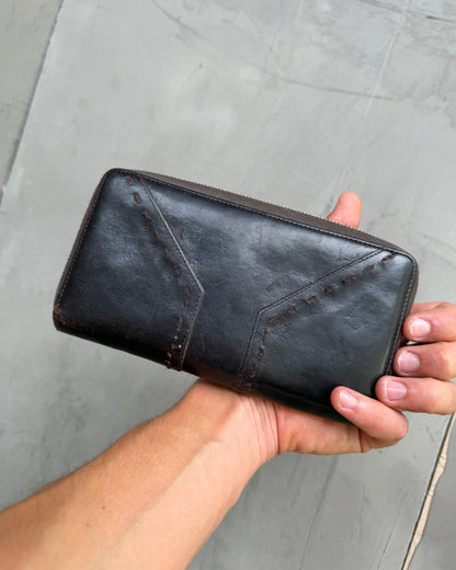 Yves Saint Laurent Leather Wallet-on a concrete background