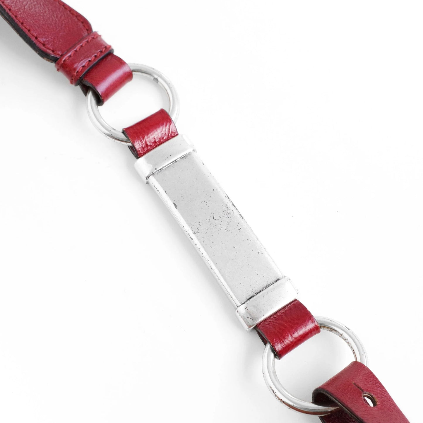 Yves Saint Laurent SS 2002 Tom Ford era red leather mombasa sling bag with a half-moon shape, chain leather strap and top zip closure. Available at Artefact Archive.