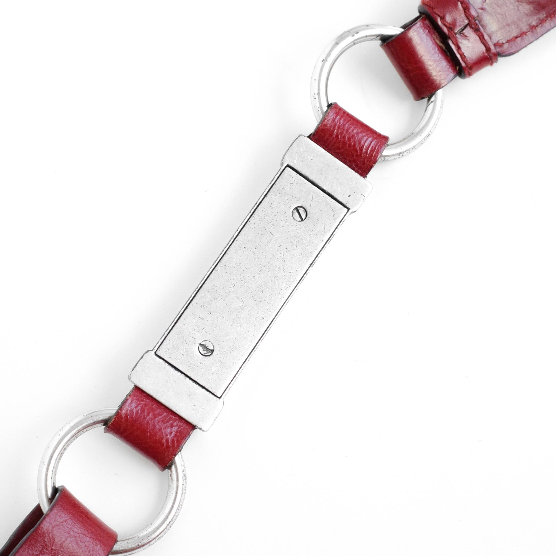 Yves Saint Laurent SS 2002 Tom Ford era red leather mombasa sling bag with a half-moon shape, chain leather strap and top zip closure. Available at Artefact Archive.