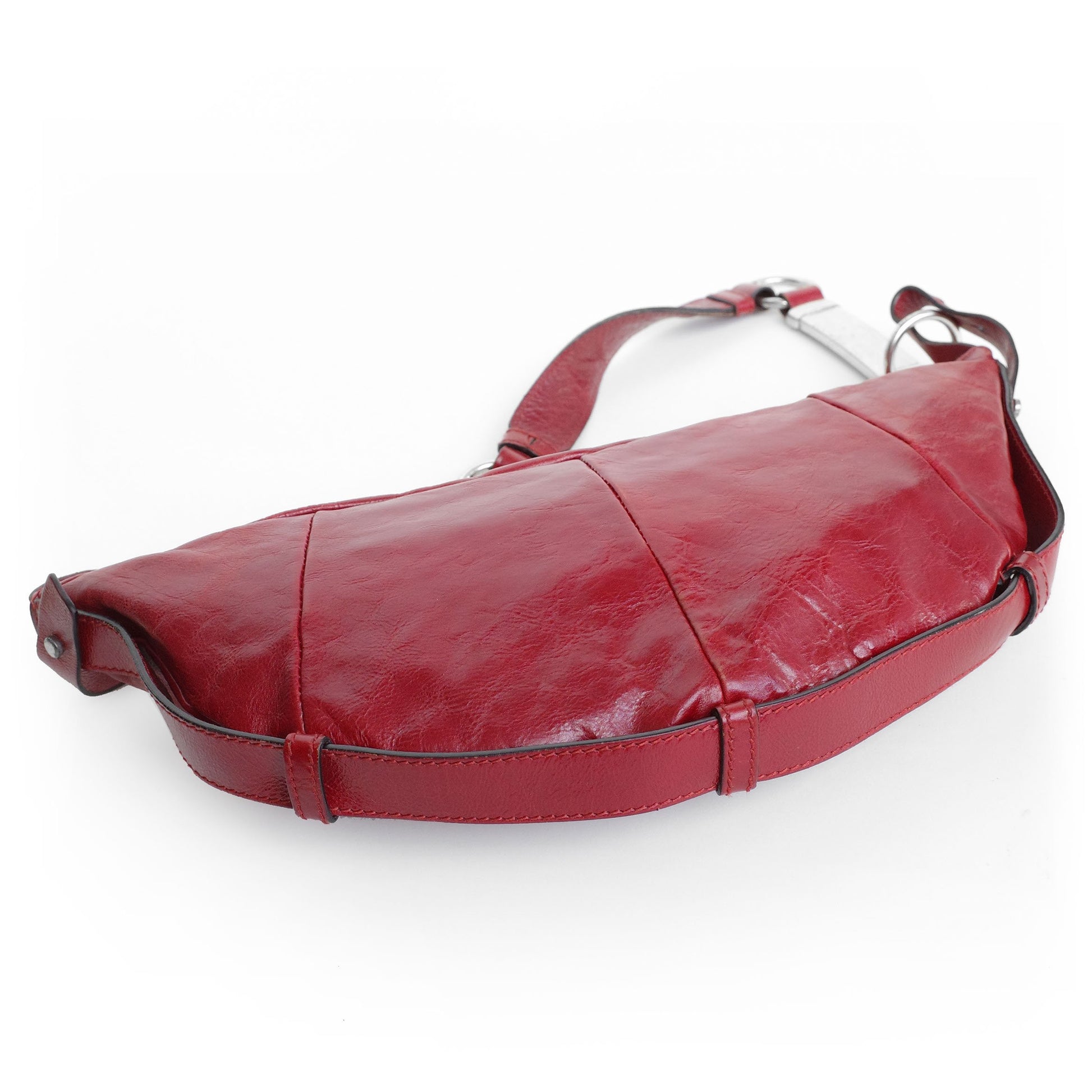 Yves Saint Laurent SS 2002 Tom Ford era red leather mombasa sling bag with a half-moon shape, chain leather strap and top zip closure. Available at Artefact Archive.