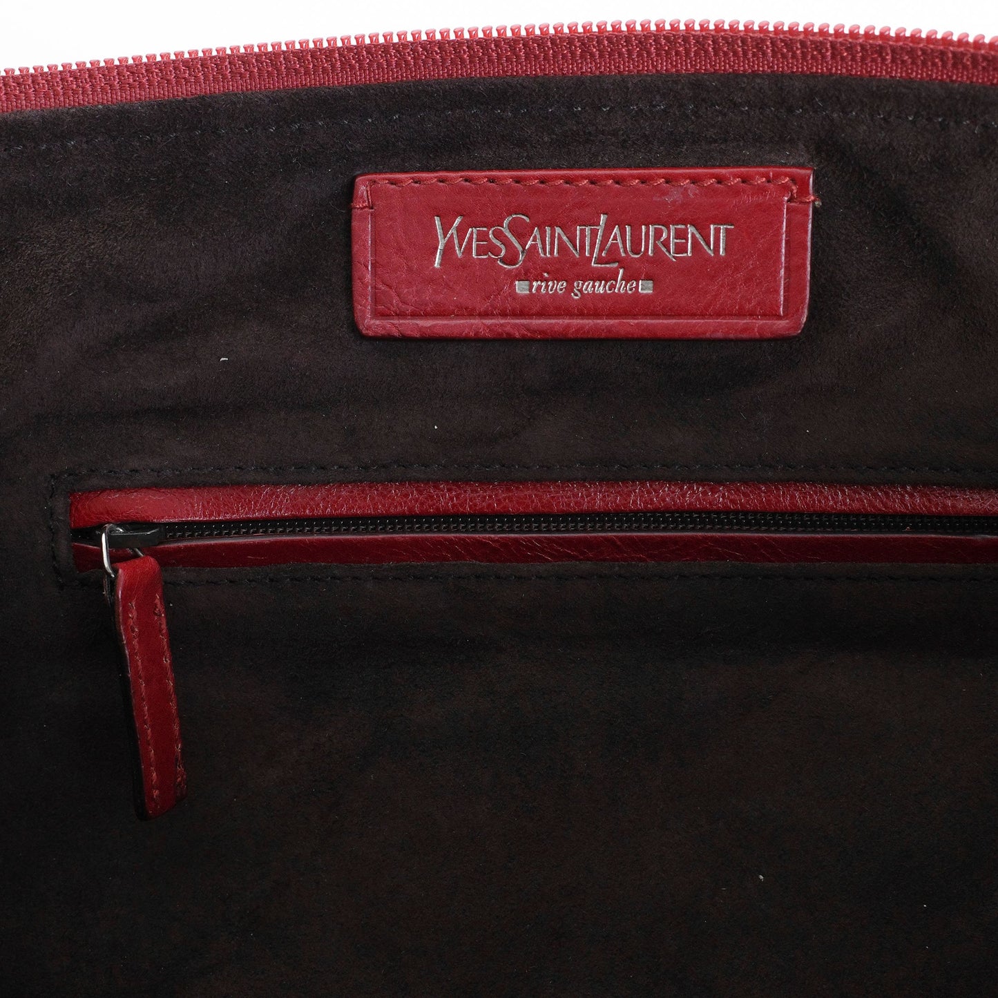 Yves Saint Laurent SS 2002 Tom Ford era red leather mombasa sling bag with a half-moon shape, chain leather strap and top zip closure. Available at Artefact Archive.