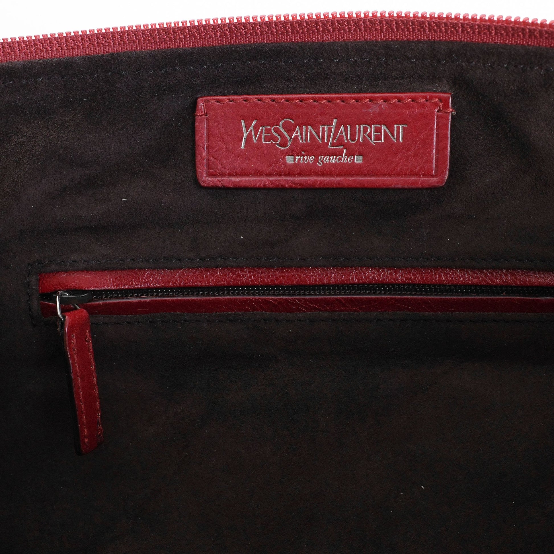 Yves Saint Laurent SS 2002 Tom Ford era red leather mombasa sling bag with a half-moon shape, chain leather strap and top zip closure. Available at Artefact Archive.