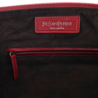 Yves Saint Laurent SS 2002 Tom Ford era red leather mombasa sling bag with a half-moon shape, chain leather strap and top zip closure. Available at Artefact Archive.