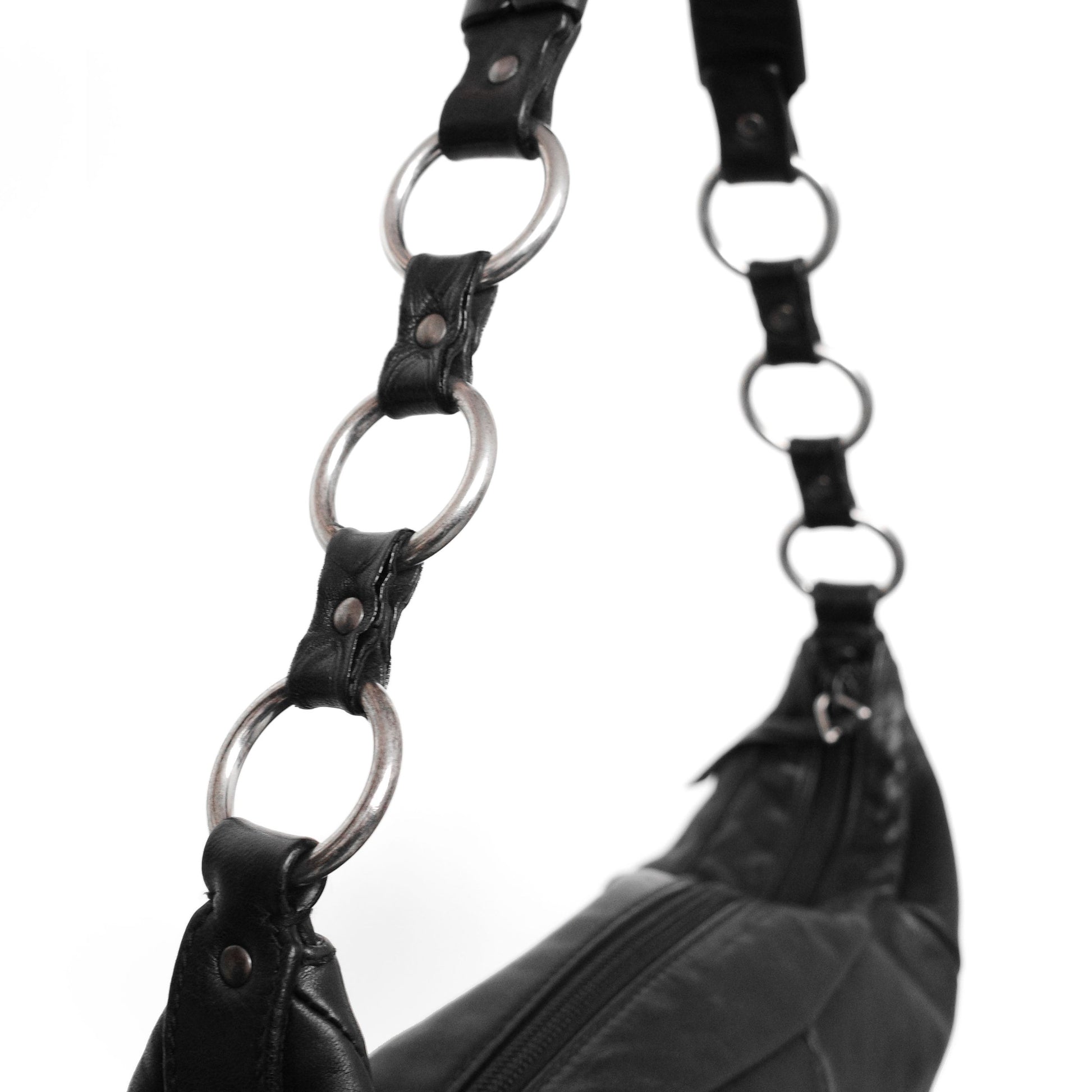 Yves Saint Laurent SS 2002 Tom Ford era leather mombasa sling bag with a half-moon shape, chain leather strap and top zip closure. Available at Artefact Archive.