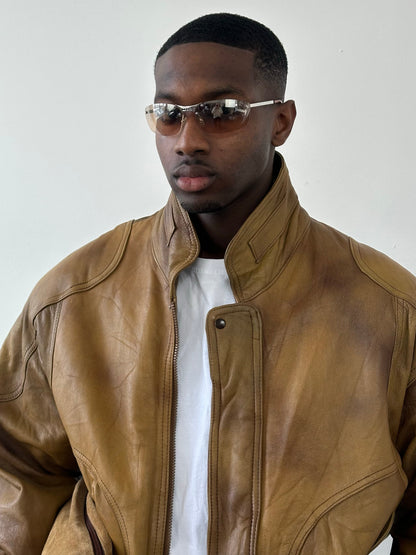 Vintage 1990s leather bomber jacket with high neck, black leather, and classic style, size large, from the Vintage brand.