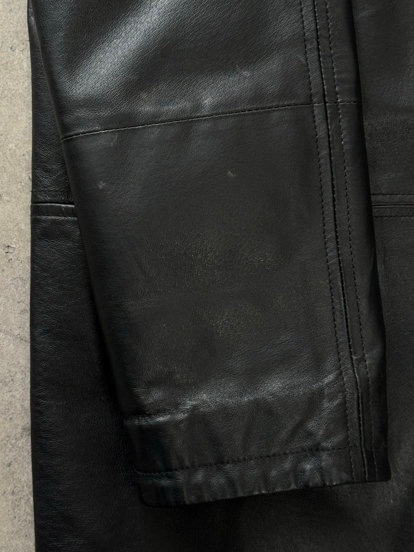 Vintage Italian 1990s single-breasted leather jacket, size large, shown on a hanger with classic design and rich leather texture.