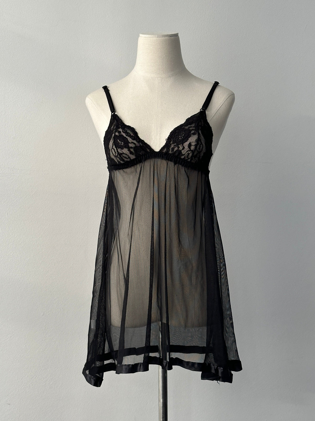 Vintage 2000s sheer babydoll sleeveless top, size small, with delicate fabric and vintage style, displayed on a neutral background.