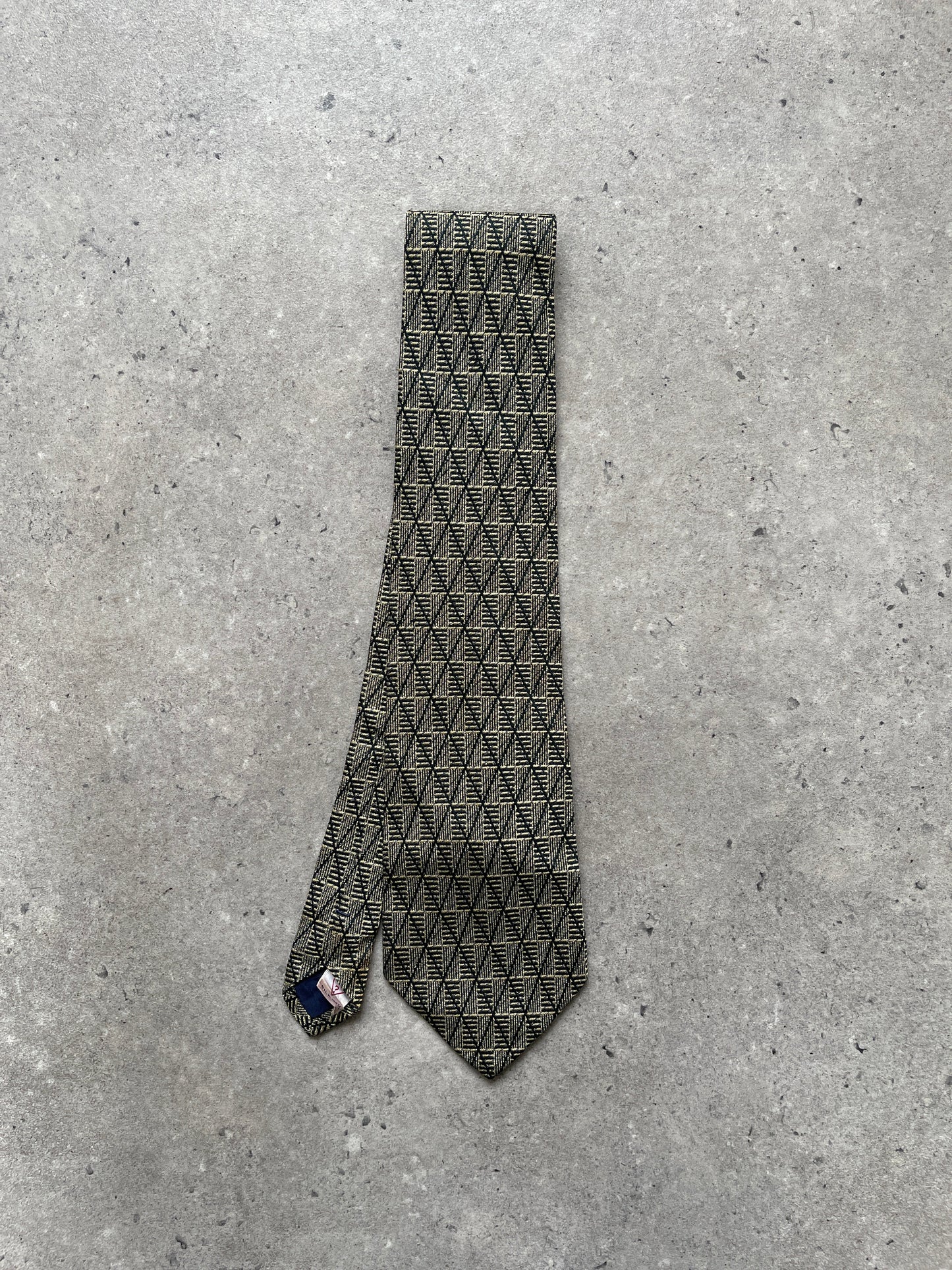 Guess 1990s pure silk print tie featuring vibrant patterns, shown laid flat with detailed close-up of fabric and design.