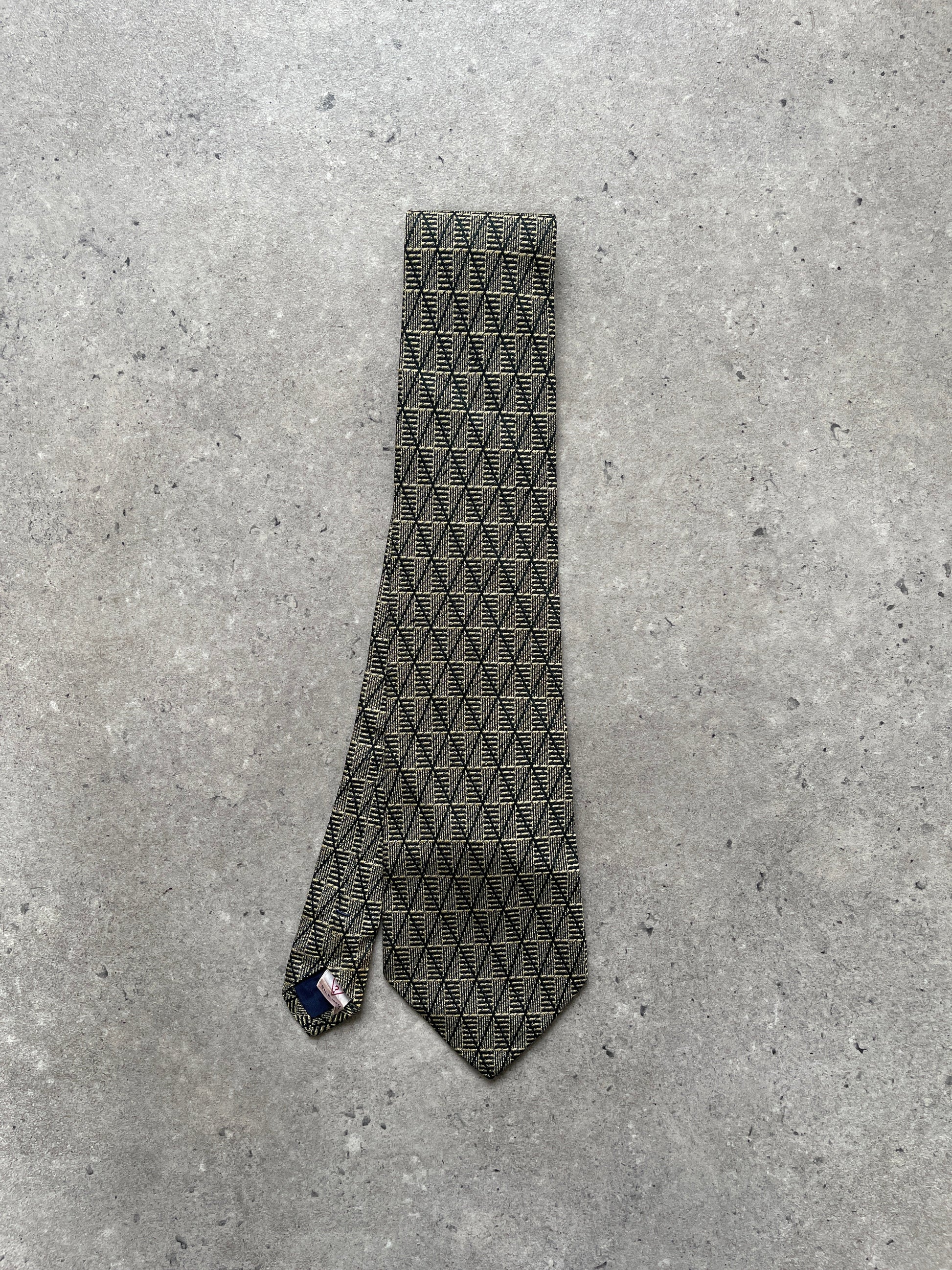 Guess 1990s pure silk print tie featuring vibrant patterns, shown laid flat with detailed close-up of fabric and design.