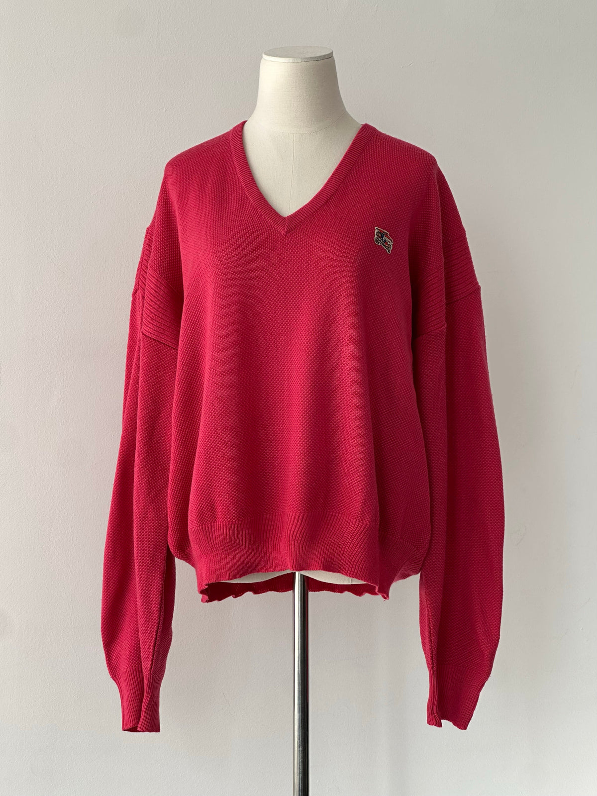 Burberry 1980s V-neck logo knit jumper in size L, featuring classic Burberry branding and a V-neck design.