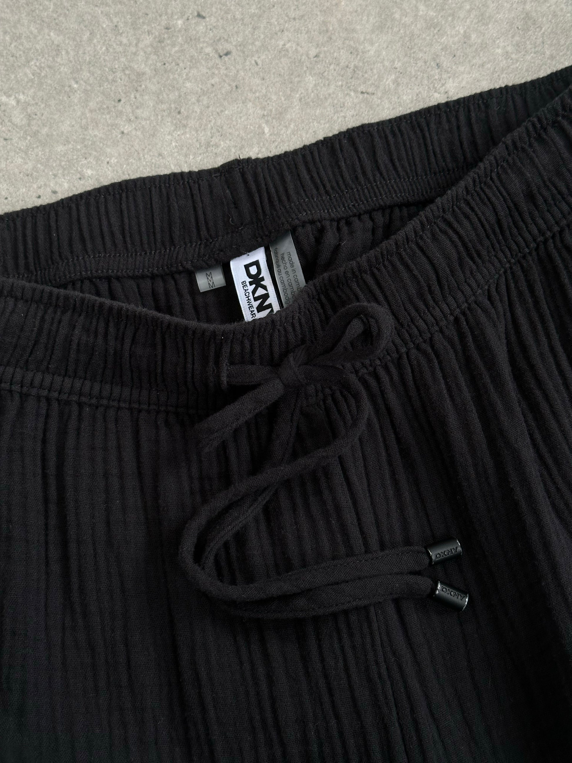 DKNY beachwear wide leg trousers in pure cotton, featuring a 2000s style, displayed in a natural pose with a neutral background.