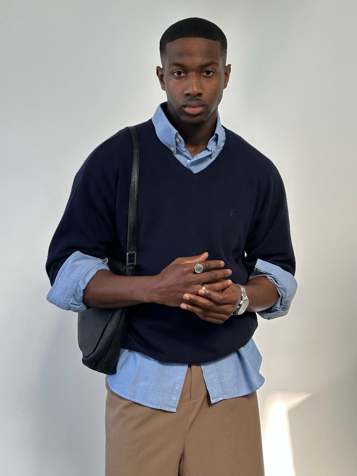 Yves Saint Laurent Pour Homme 1990s wool V-neck jumper in size L, navy blue sweater with ribbed collar and cuffs.