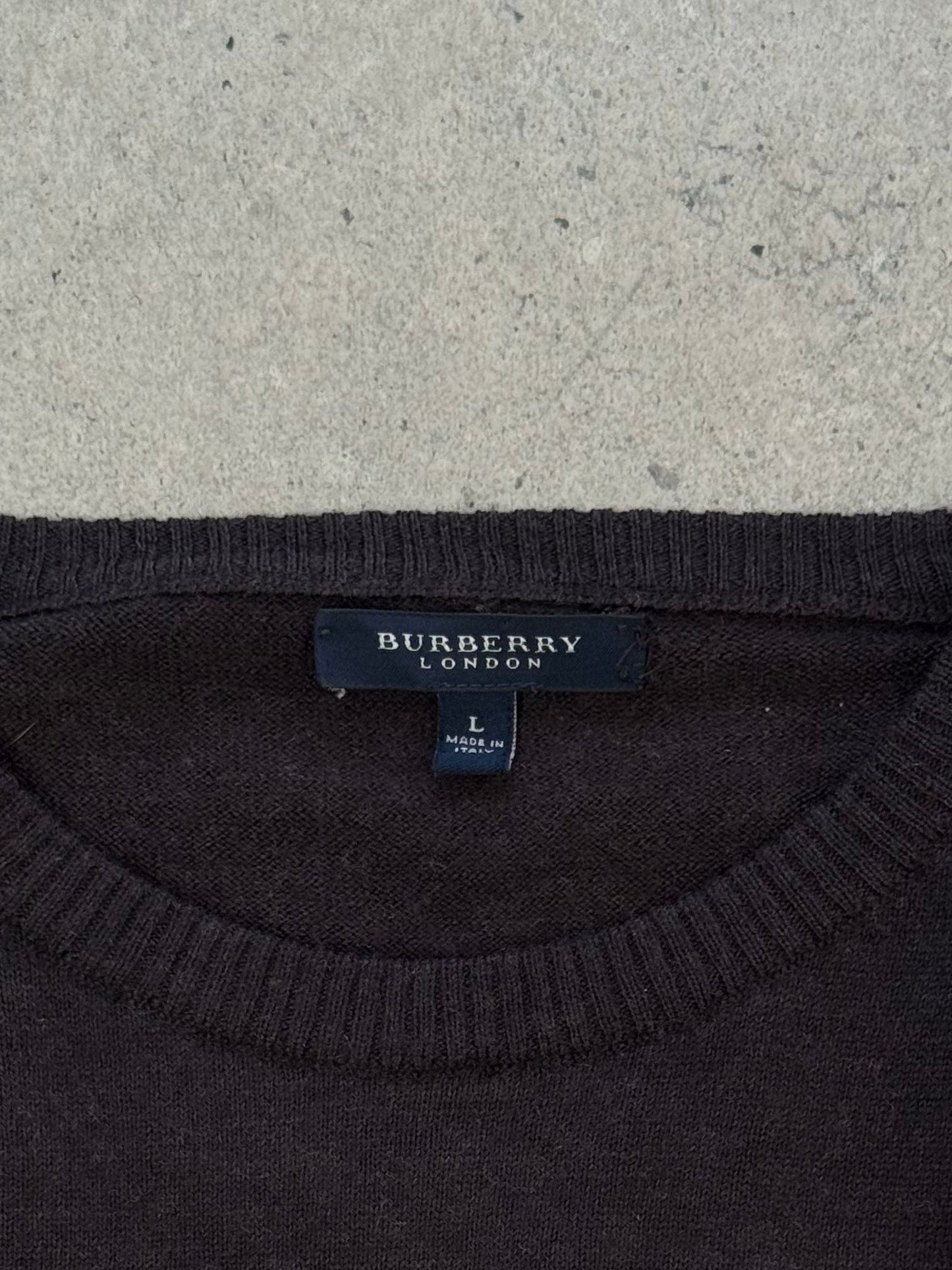 Burberry London 2000s wool knit jumper in size M, featuring classic design and textured knit pattern, displayed on a neutral background.