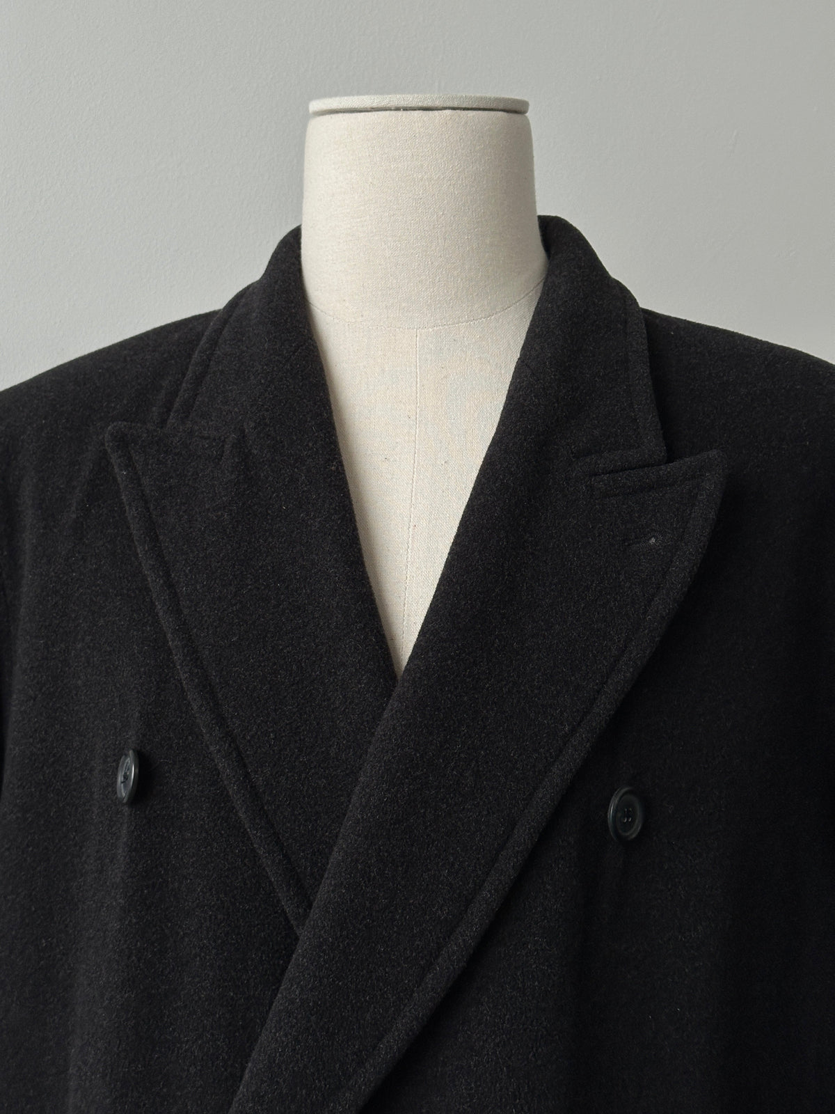 Vintage 1990s pure wool double-breasted coat, XL size, showcasing classic design and textured fabric.