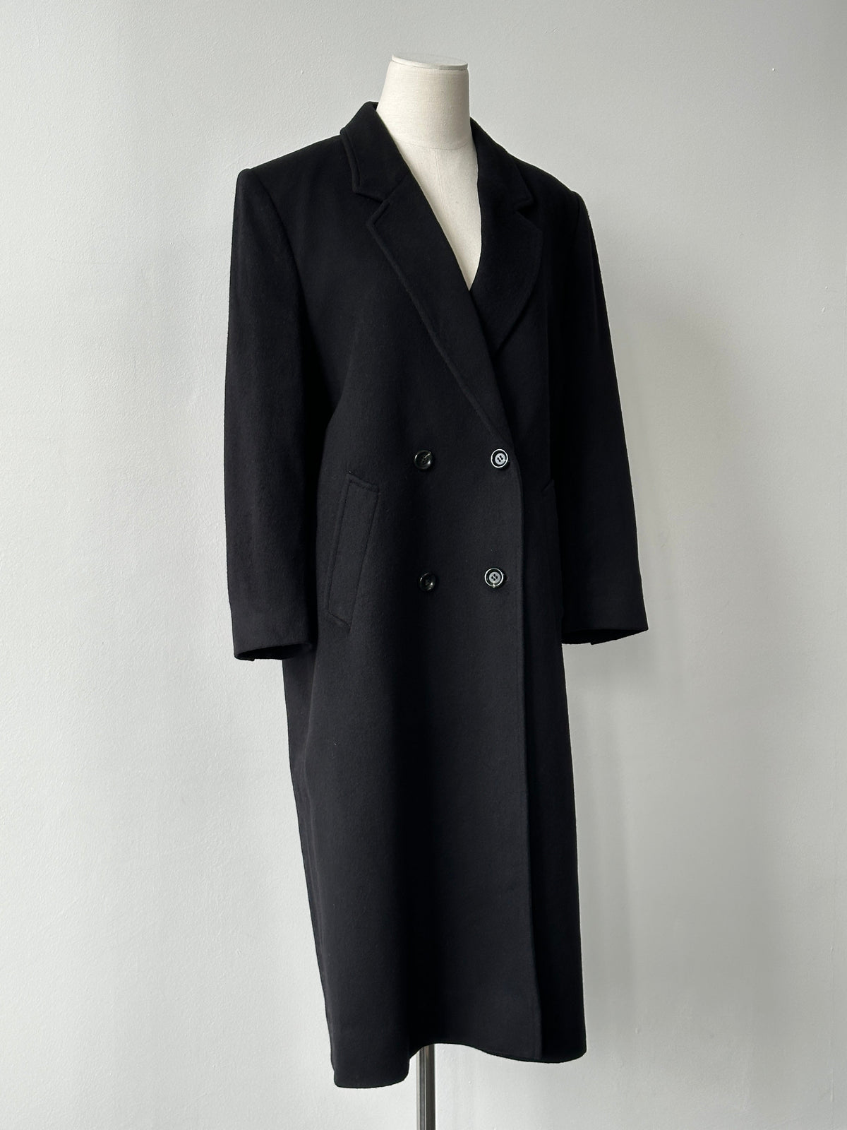 Vintage 1990s pure cashmere double-breasted coat, stylish and warm, shown in classic design with a tailored fit in a natural pose.