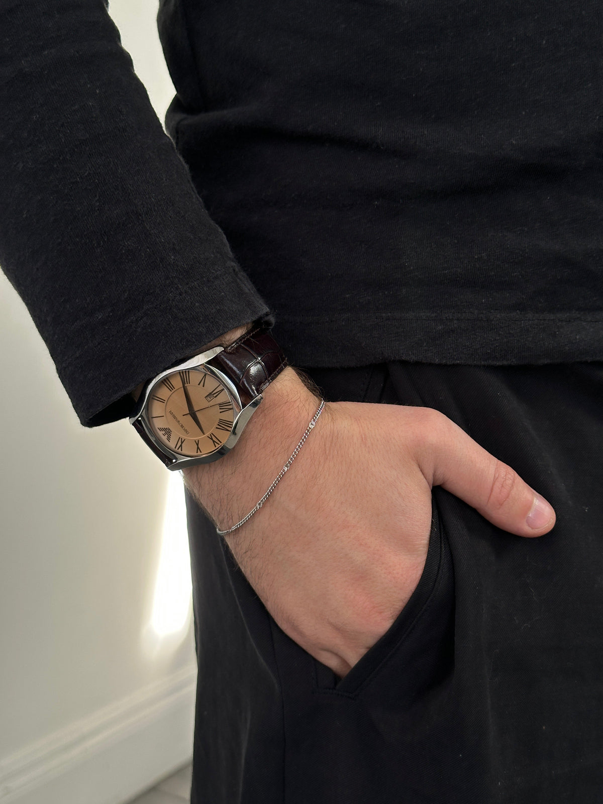 Emporio Armani 2000s leather quartz watch with a sleek round dial and black leather strap, stylish and elegant accessory.
