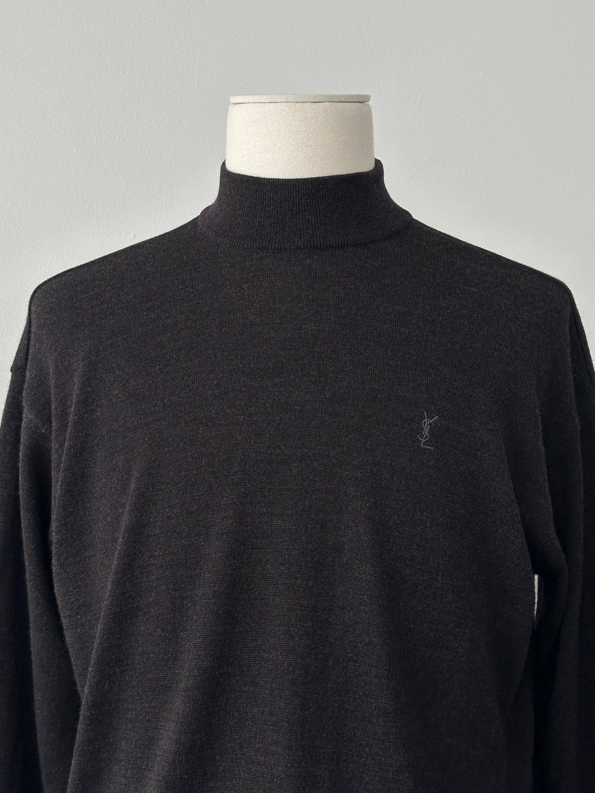 Yves Saint Laurent 1990s wool high-neck jumper in size M, showcasing a classic high-neck design and luxurious knit fabric.