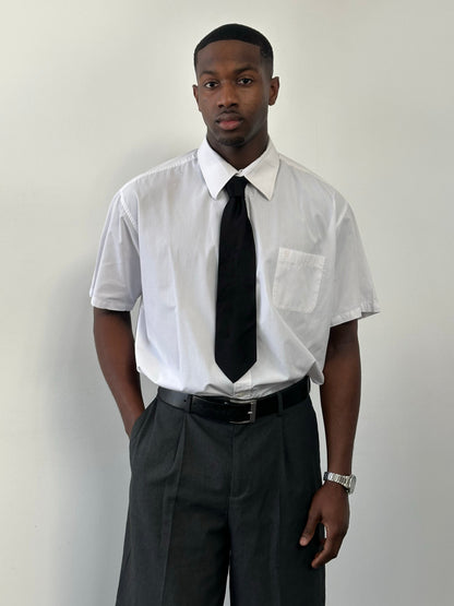Yves Saint Laurent Pour Homme 1990s cotton short sleeve logo shirt in XXL, white with black YSL branding on front.