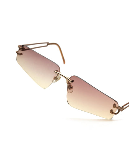 https://cdn.shopify.com/s/files/1/0818/5459/5398/files/alexander-mcqueen-alexander-mcqueen-rimless-sunglasses-vintage-su420-7365549.jpg?v=1770139713